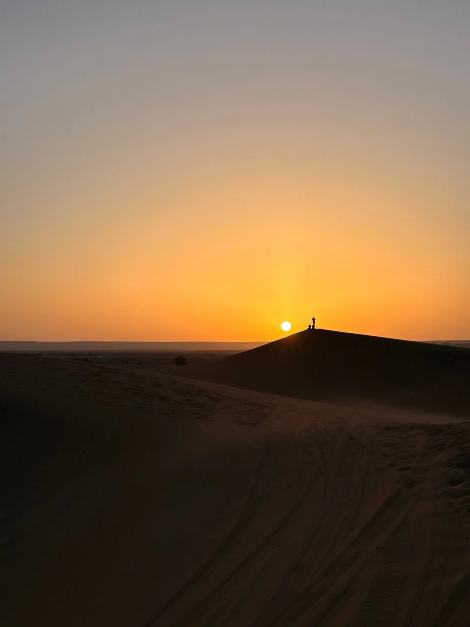 Sunset over the Sahara dunes near Merzouga